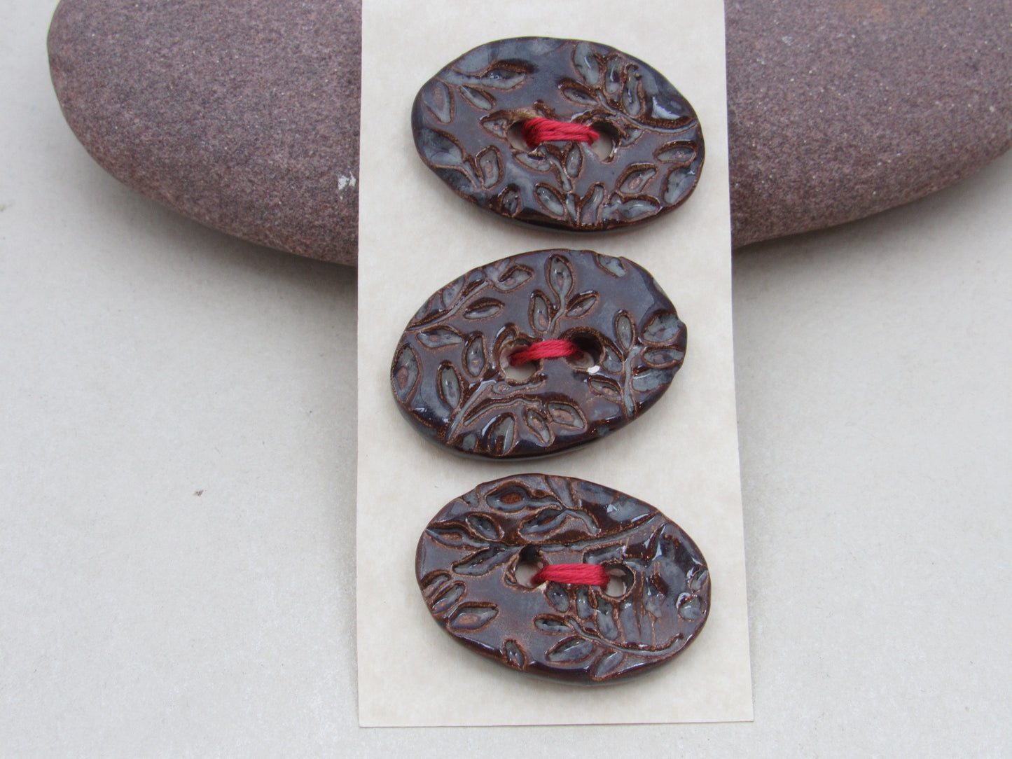 Trio of Medium Oval Sprig Pattern Ceramic Buttons