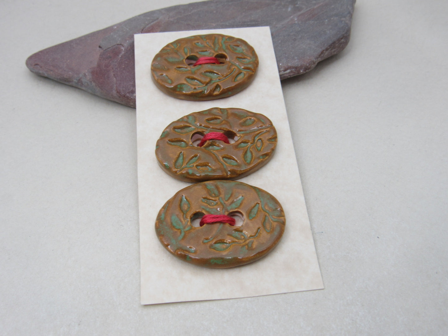 Trio of Medium Oval Sprig Pattern Ceramic Buttons